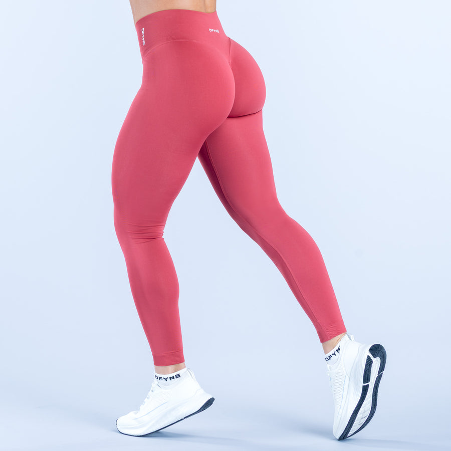 Fitted pink leggings with high waistband and full-length stretch
