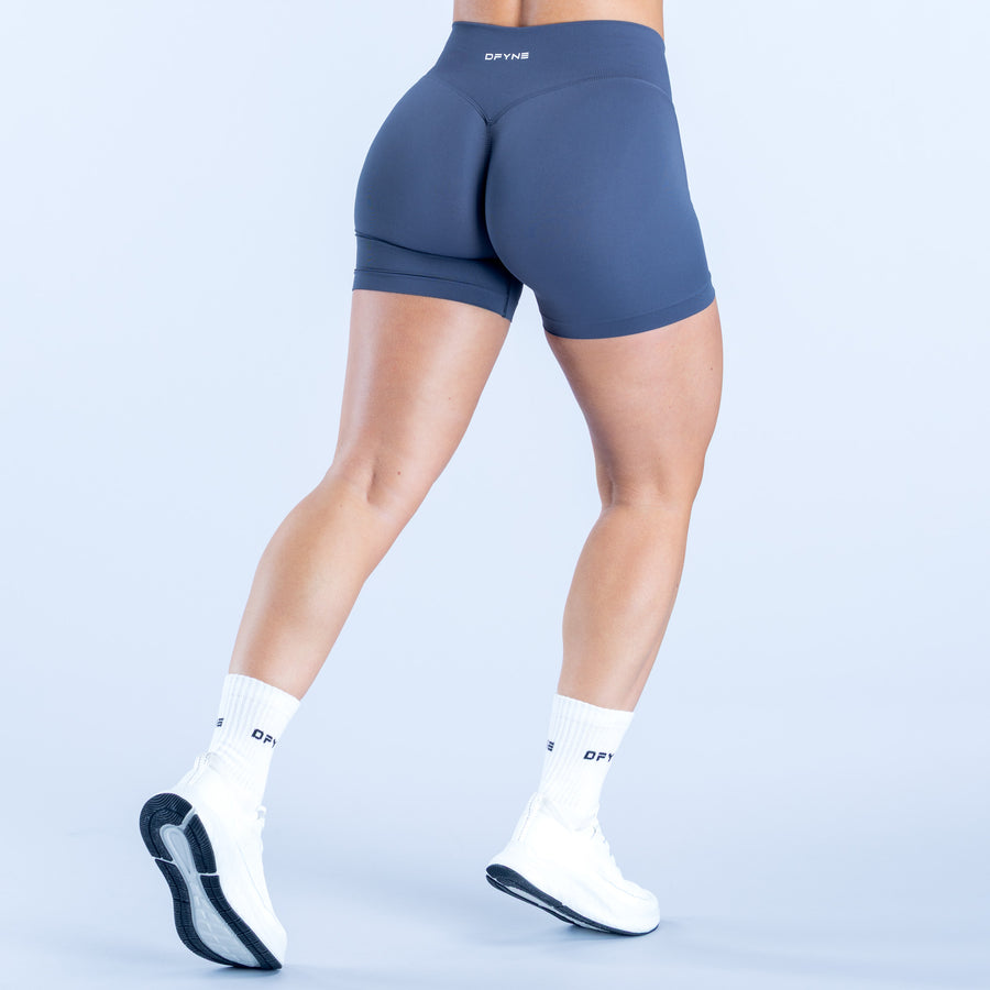 Navy 4.5-inch athletic shorts, back view with contoured seams and logo