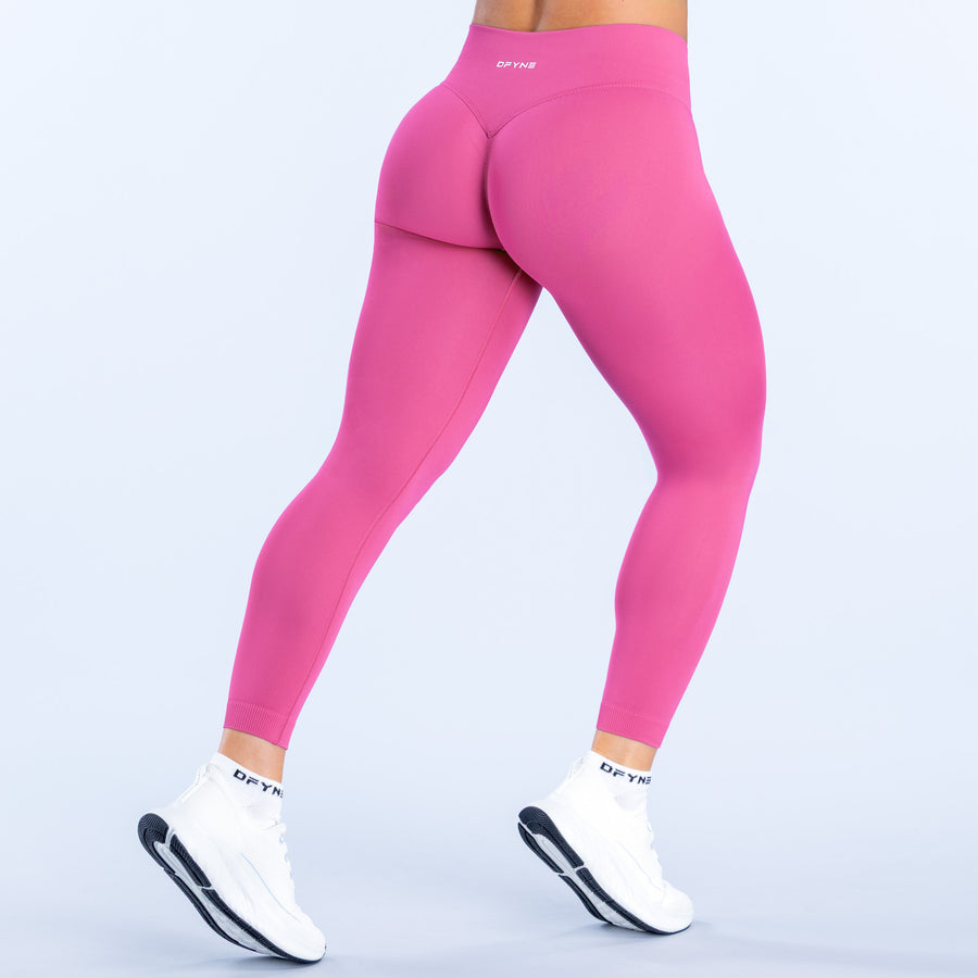 Pink high-rise leggings, back view, contoured seat panel and curved waistband