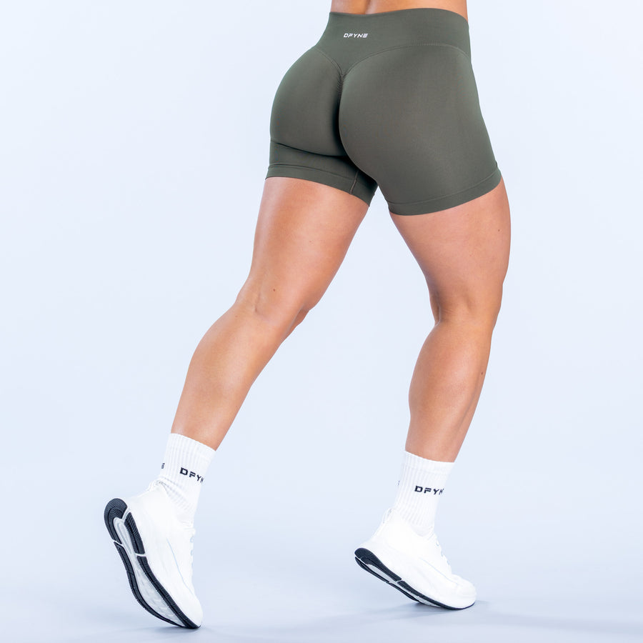 Defy 4.5-inch olive performance shorts, rear view, smooth stretch fabric