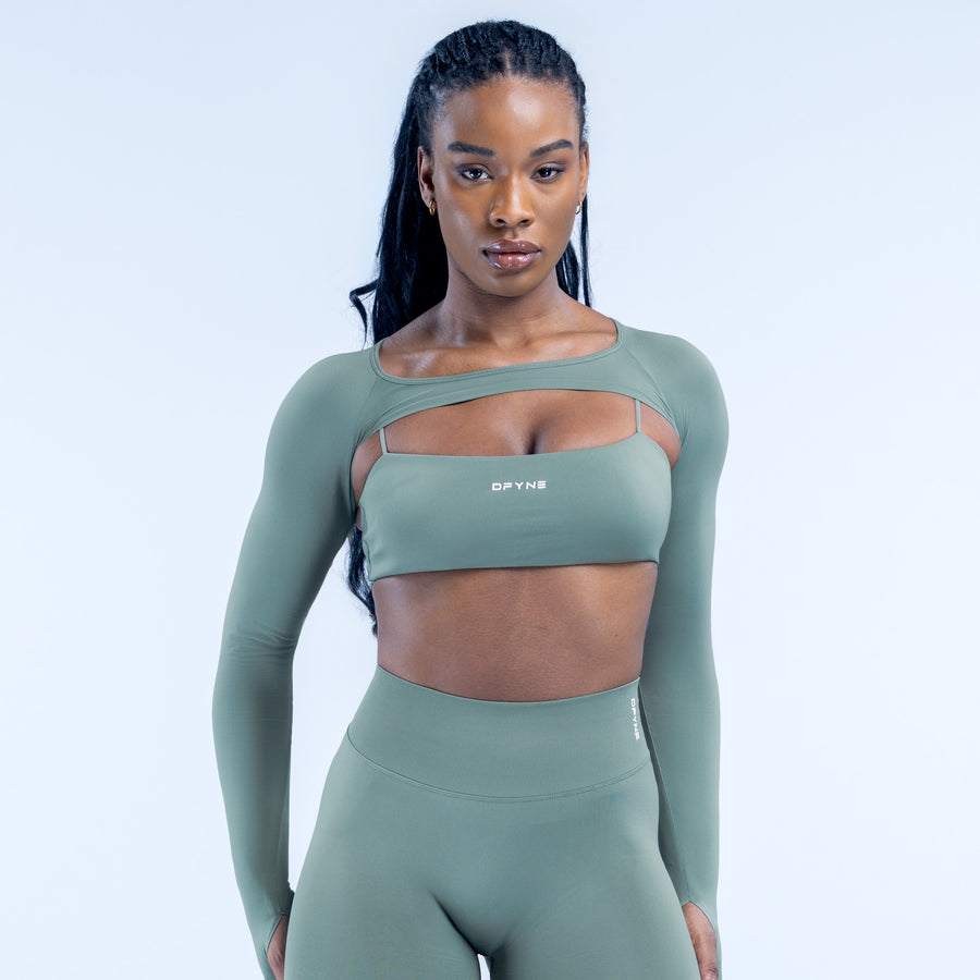 Sage green long-sleeve cropped shrug with seam at hem and wide neckline