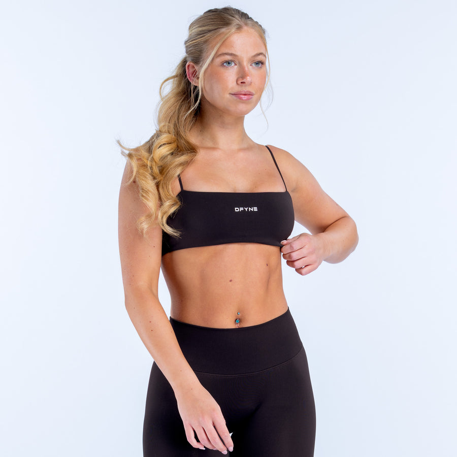 Black strappy bra with thin straps and wide band underbust, seamless look