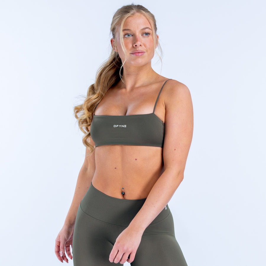 Dark green strappy sports bra with square neckline and thin shoulder straps