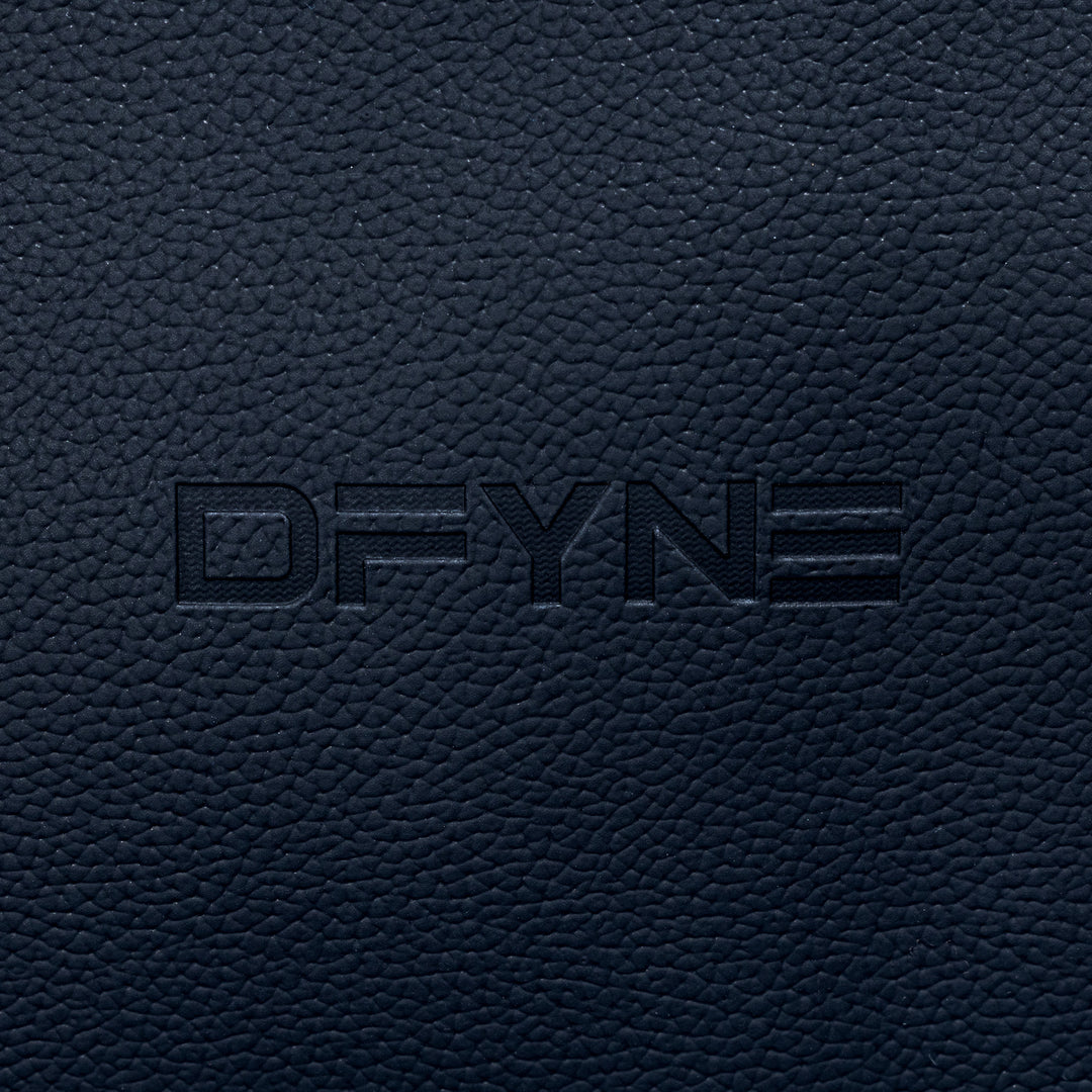 Duffle bag embossed logo on dark textured surface