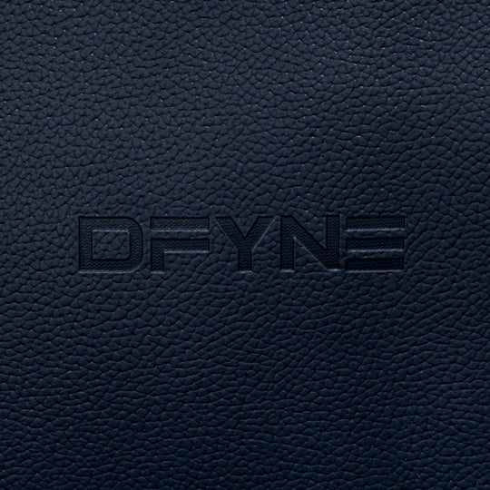 Duffle bag embossed logo on dark textured surface
