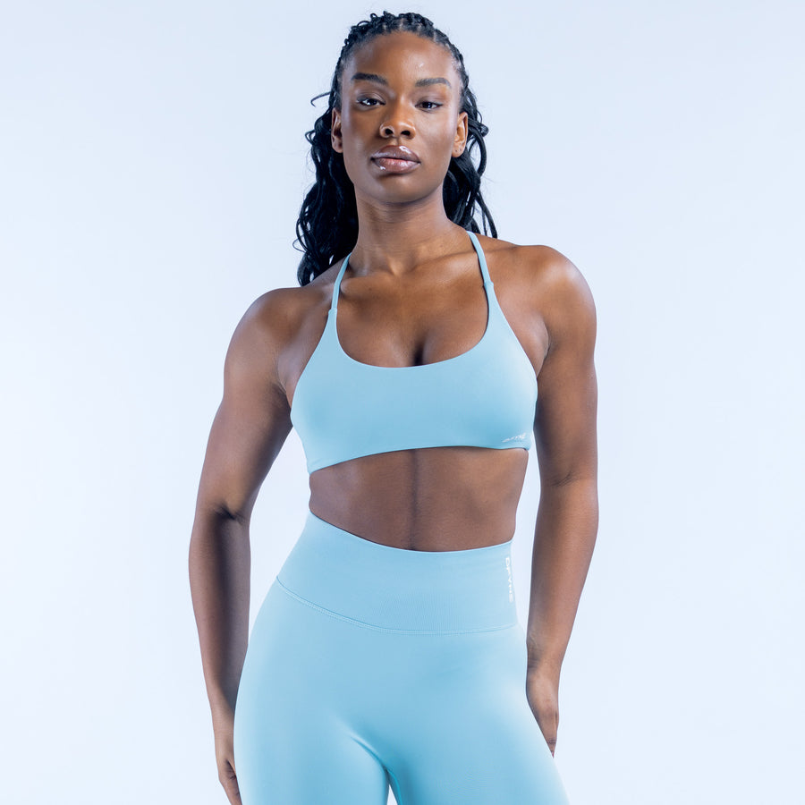 Light blue sports bra with racerback straps and scoop front