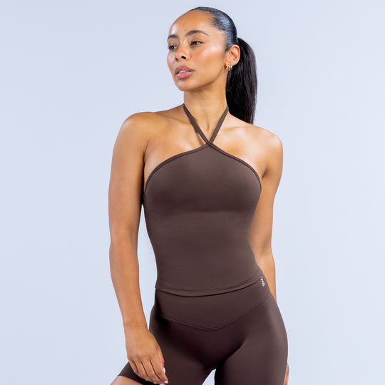 Dark brown longline halter top with crisscross neck straps and fitted front