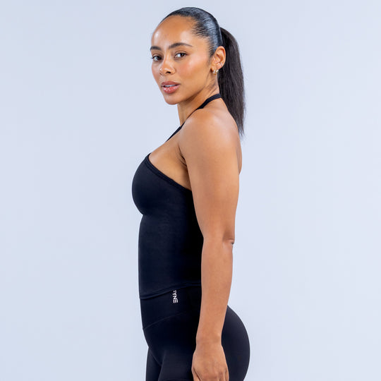 Black fitted longline halter top with side seam detailing and low racerback