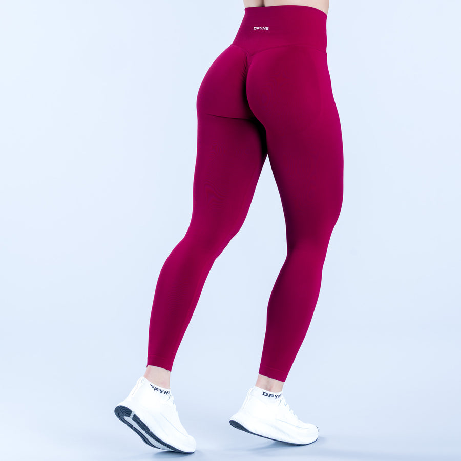 Burgundy high-rise leggings, rear view, sculpting seams and full-length fit