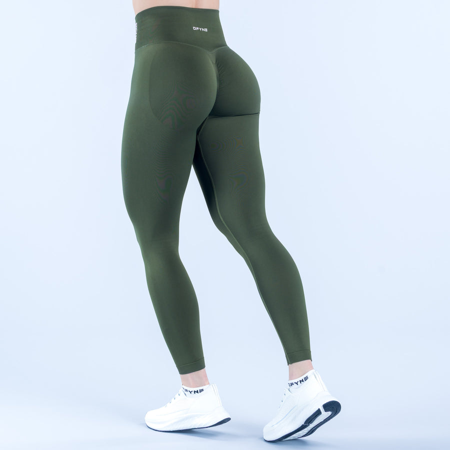 Dark green performance leggings, back view with smooth seams and small waistband logo.