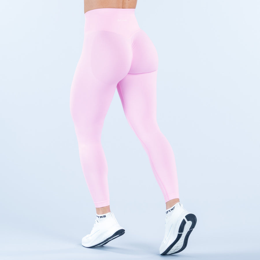 Light pink high-waist leggings with fitted waistband and full-length leg coverage