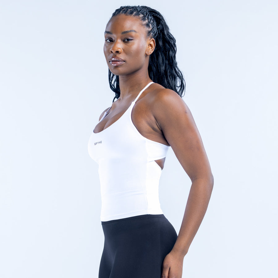 White twist-back sports top with racerback straps and wide neckline