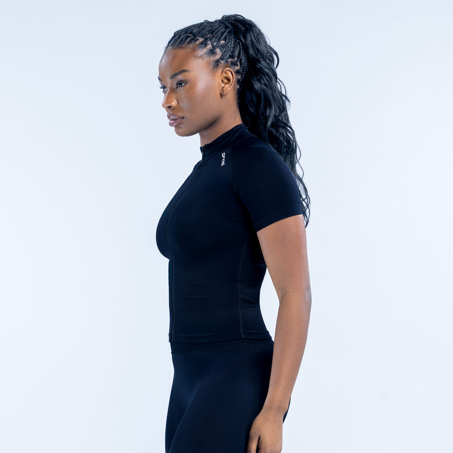 Black short-sleeve zip-front athletic set, side view with fitted top and leggings