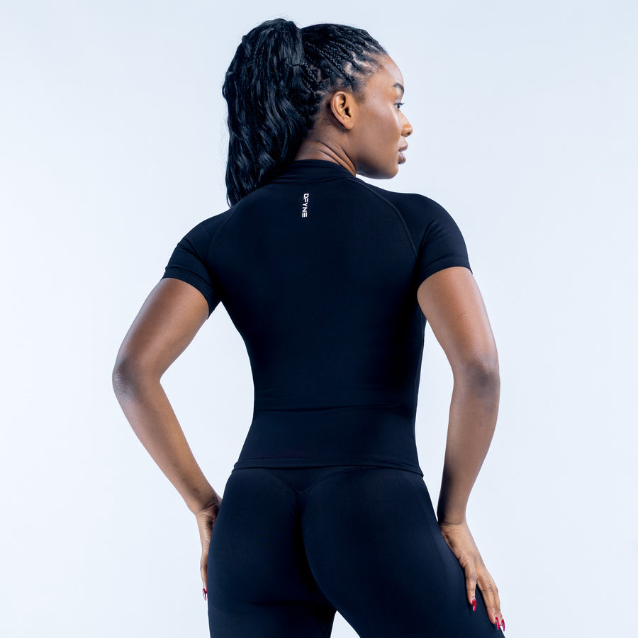 Black short-sleeve zip athletic set from back, fitted top and leggings