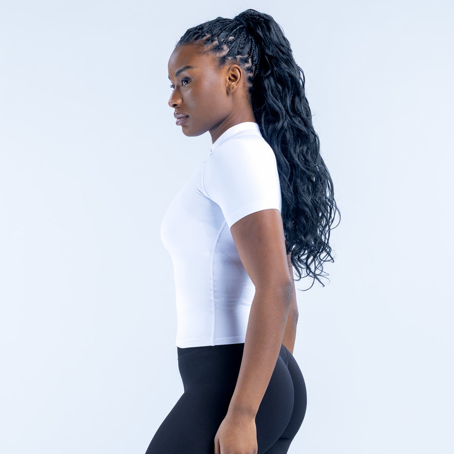 White short-sleeve zip-up top, fitted with full front zipper and high neckline