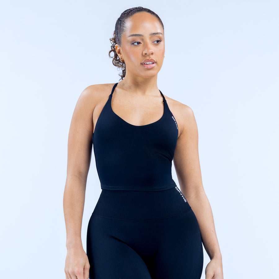 Dynamic strappy workout top, dark solid color, scoop neckline and thin straps