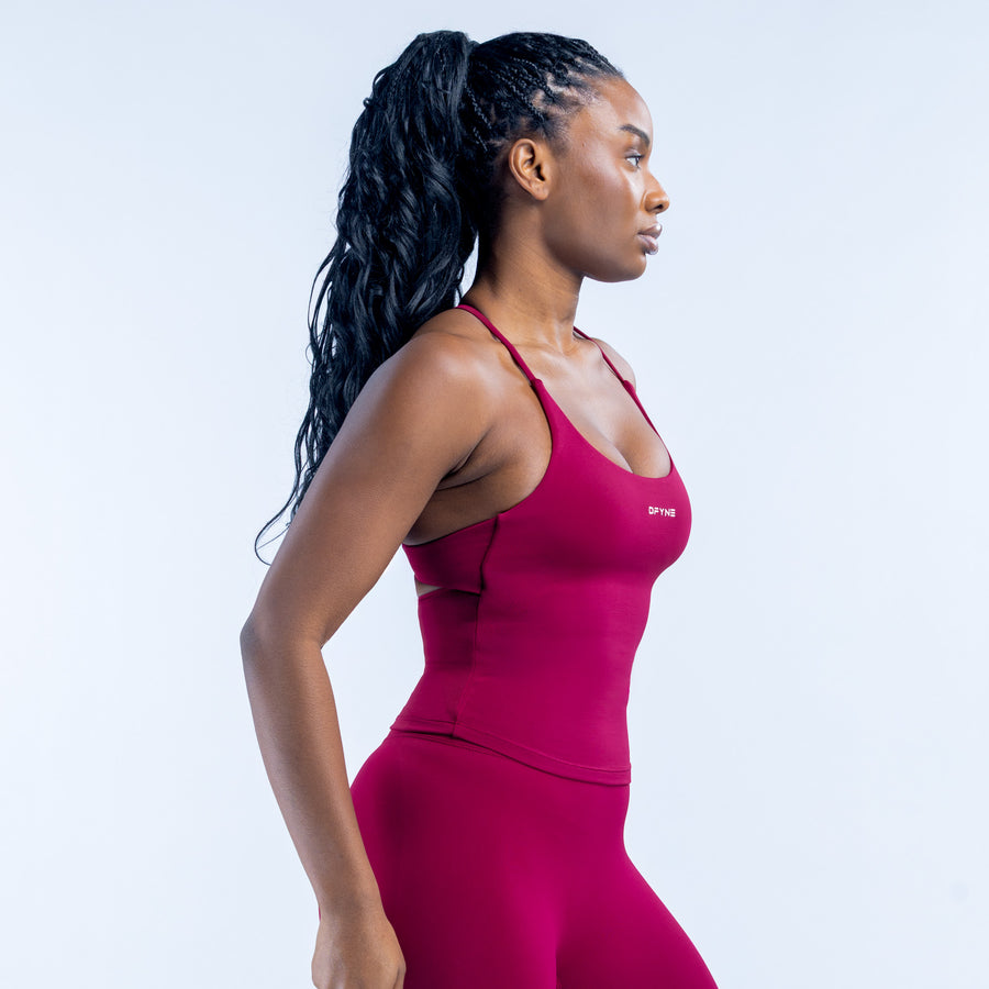 Magenta sports top with open-back straps and racerback cut