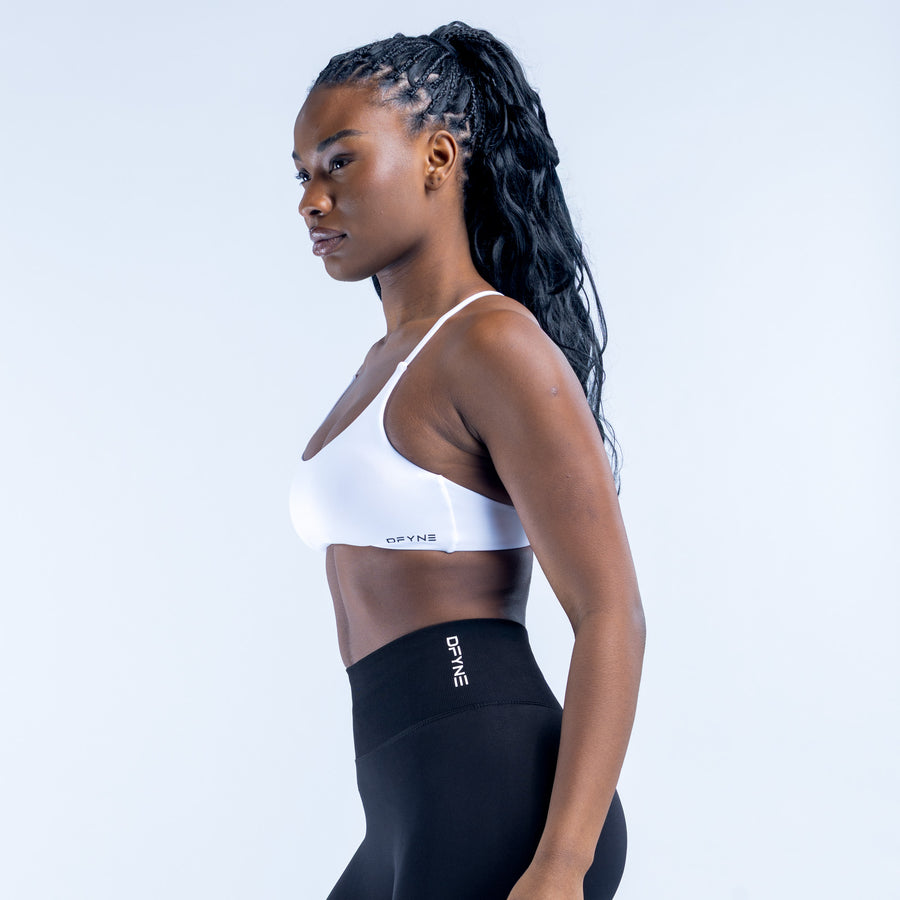 White sports bra with thin straps, side view
