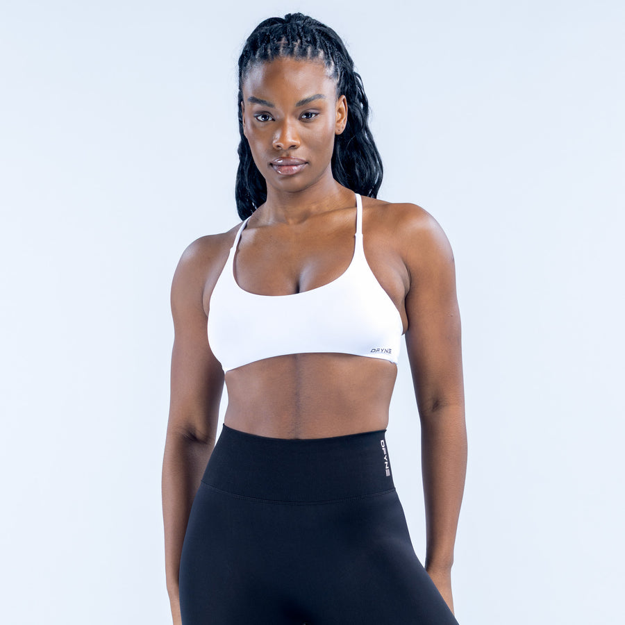 White sports bra with smooth cups and elastic underband