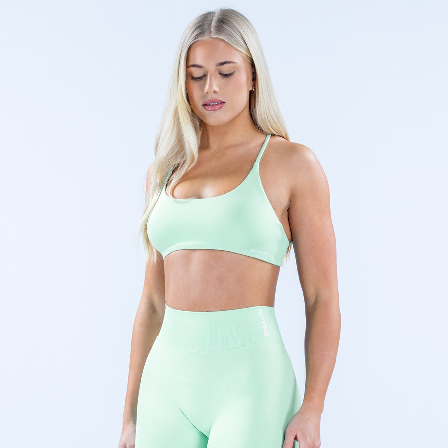 Mint green sports bra with low scoop front and elastic underband