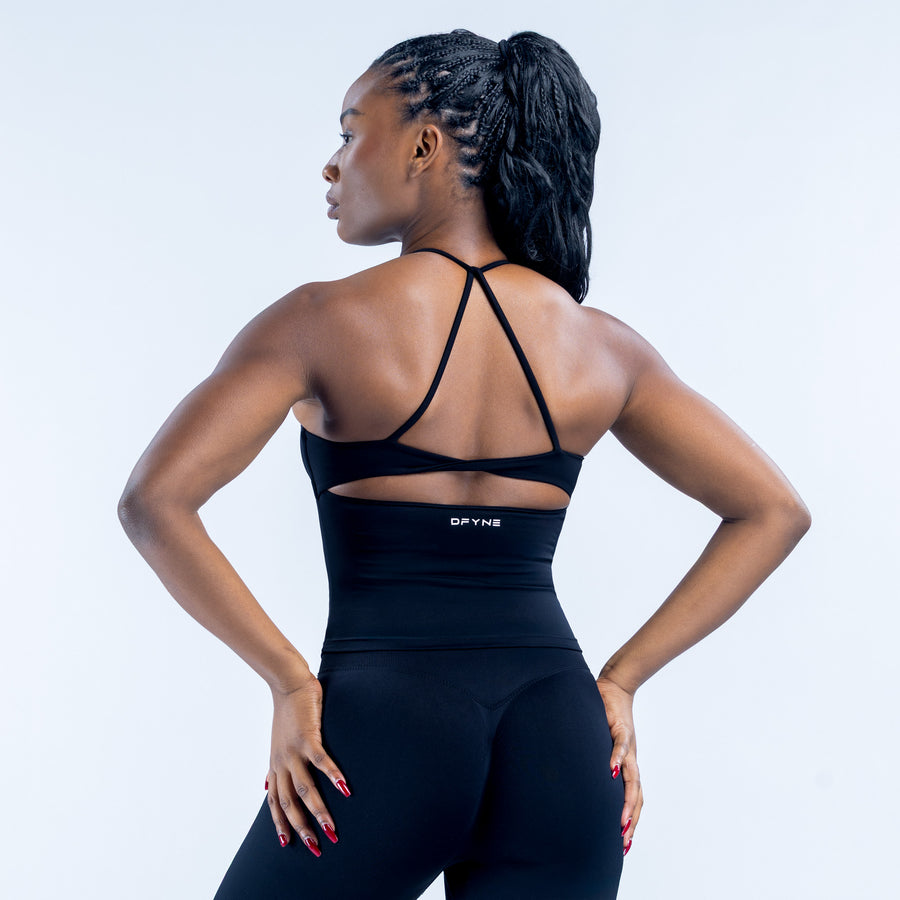 Black athletic twist-back top with crisscross open-back straps and racer trim
