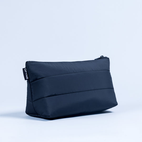 Dark navy quilted pouch with top zipper, rectangular shape and stitched seams