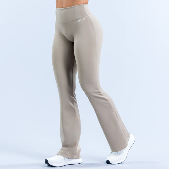 Light gray flared leggings with high-rise waistband and full-length bell hem
