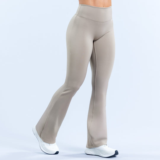 Light gray flared leggings with smooth back yoke and full-length bell hem