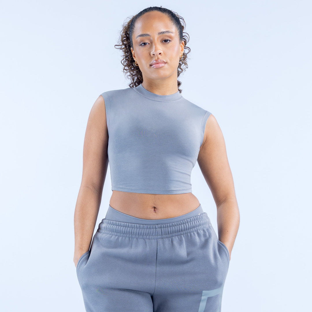 Gray sleeveless cropped baby tee with crew neck and printed logo on front