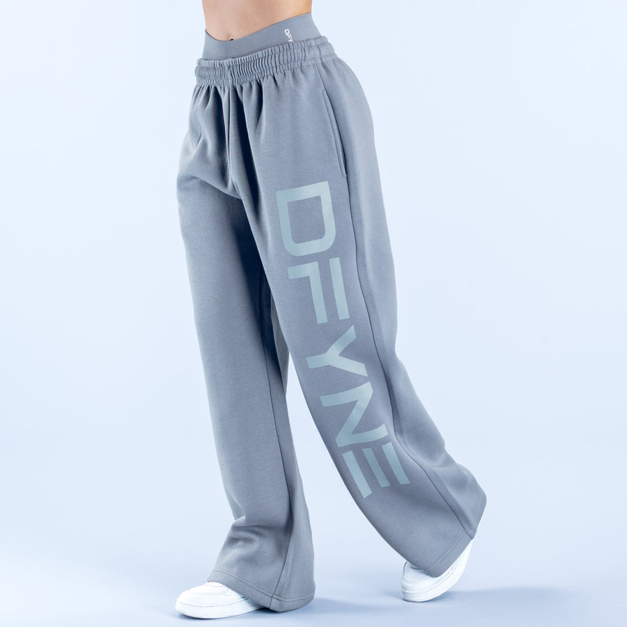 Light blue-gray wide-leg jogger pants with large vertical DIVE graphic on one leg.