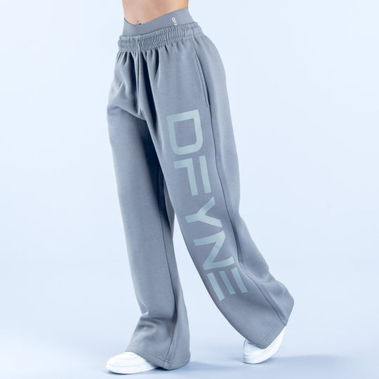 Light gray wide-leg jogger pants with elastic waistband and large front logo print
