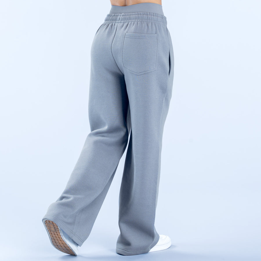 Light blue-gray wide-leg jogger pants with elastic waistband and back patch pocket.