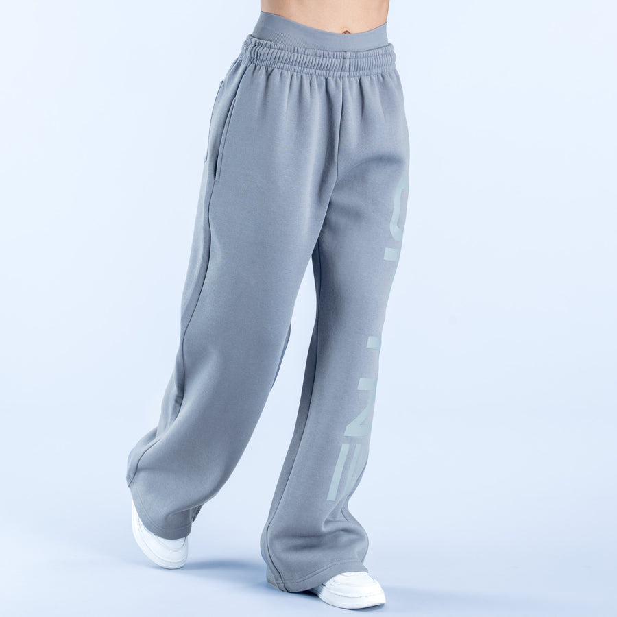 Light blue-gray wide-leg jogger pants with elastic waistband and side pockets.