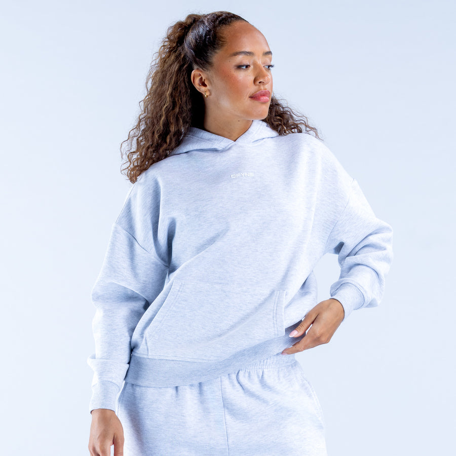 Light blue pullover hoodie with hood and kangaroo pocket, side view