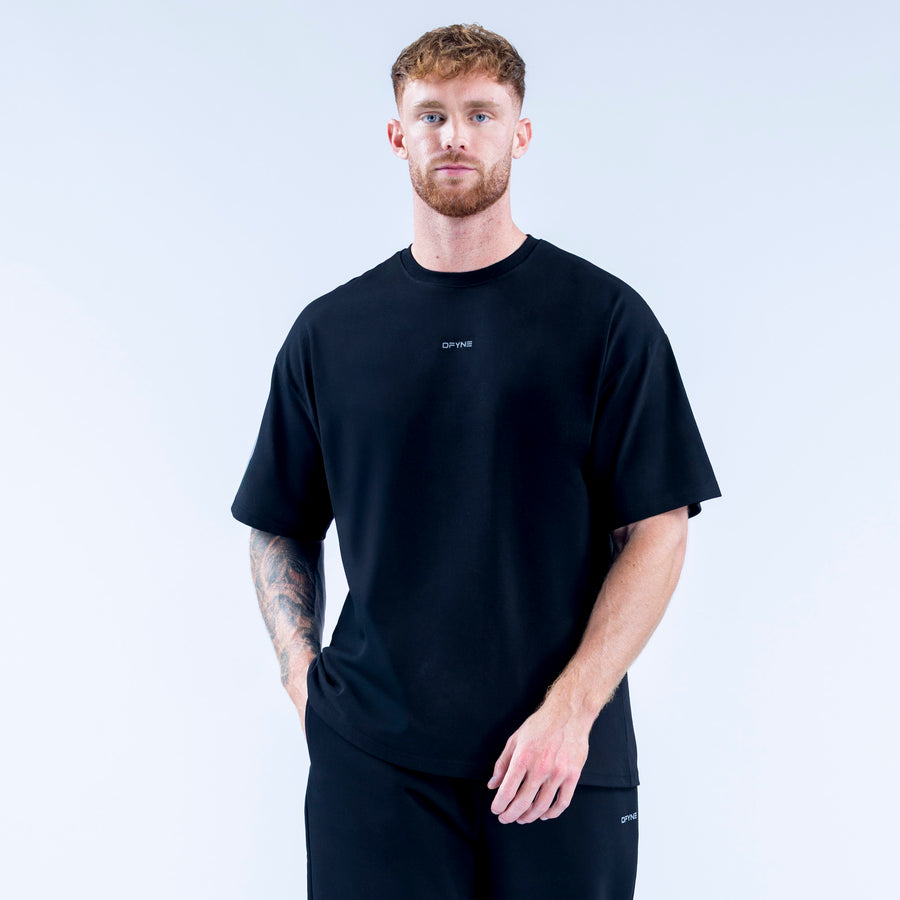 Black crew-neck T-shirt with small chest logo, short sleeves, straight hem.