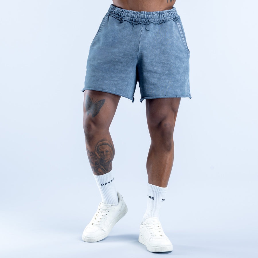 Washed blue denim shorts with elastic waistband and side pockets