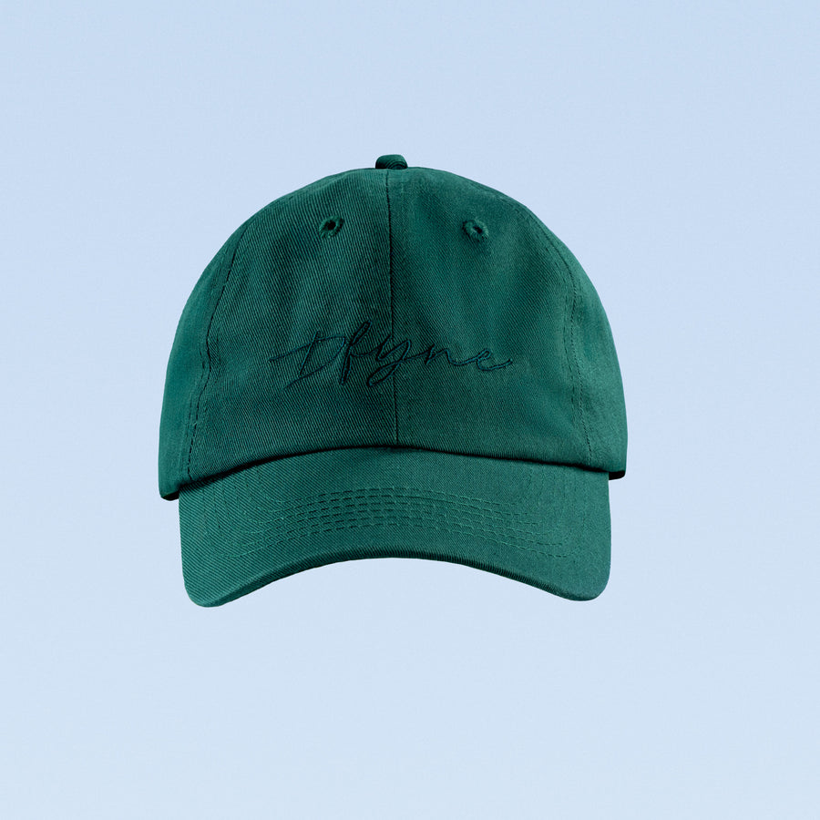 Green script baseball cap with curved brim and embroidered logo