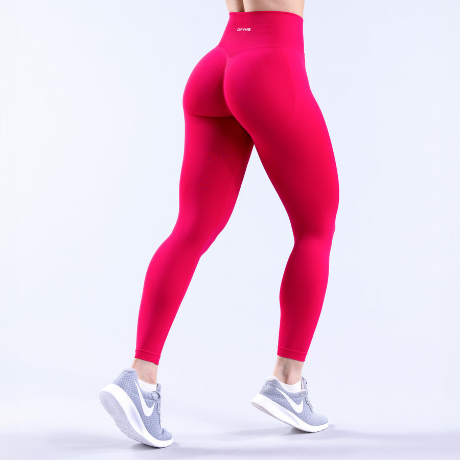 Fuchsia high-waist leggings with curved rear seam detail and ankle length