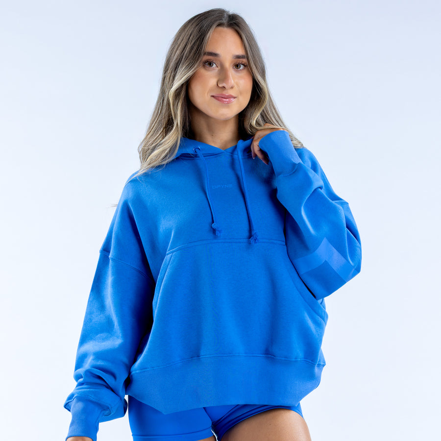 Blue pullover hoodie with hood, drawstring cords, and kangaroo pocket, long sleeves