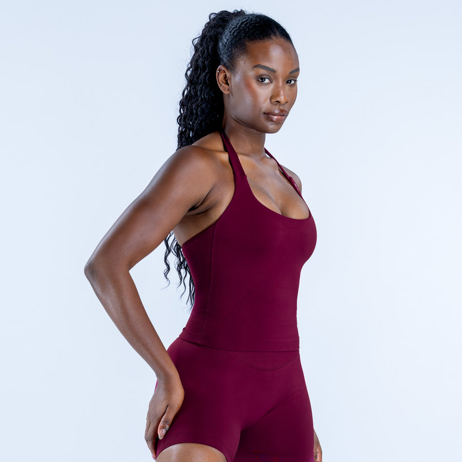 Burgundy halter impact top, sleeveless fitted silhouette with racerback
