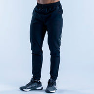 Dark navy training jogger pants with cuffed legs and elastic drawstring waistband