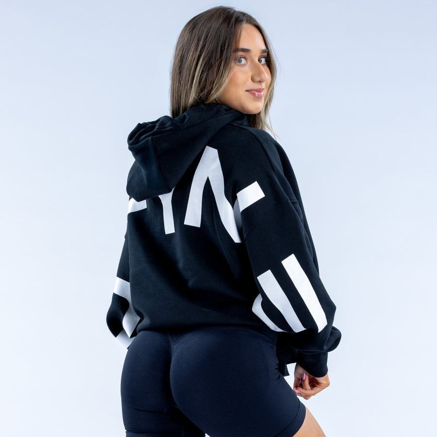 Black pullover hoodie with white back graphic and drawstring hood