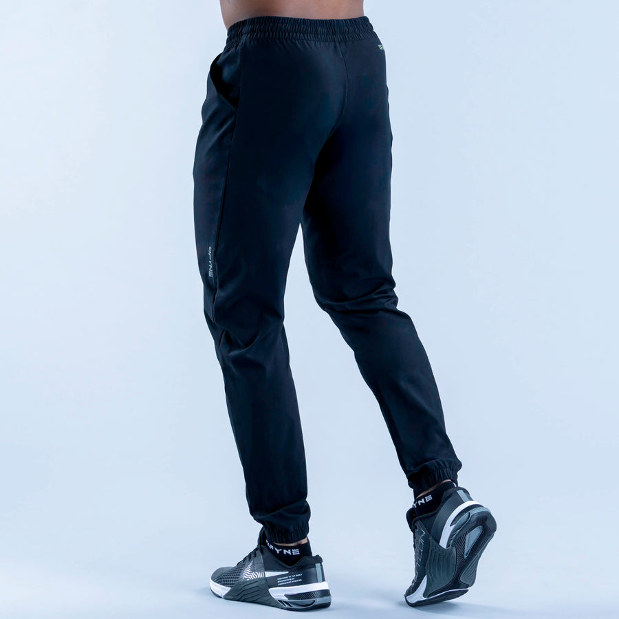 Dark navy training jogger pants with ribbed ankle cuffs and relaxed tapered leg