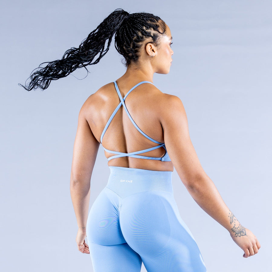 Light blue sports bra, open back with crisscross adjustable straps