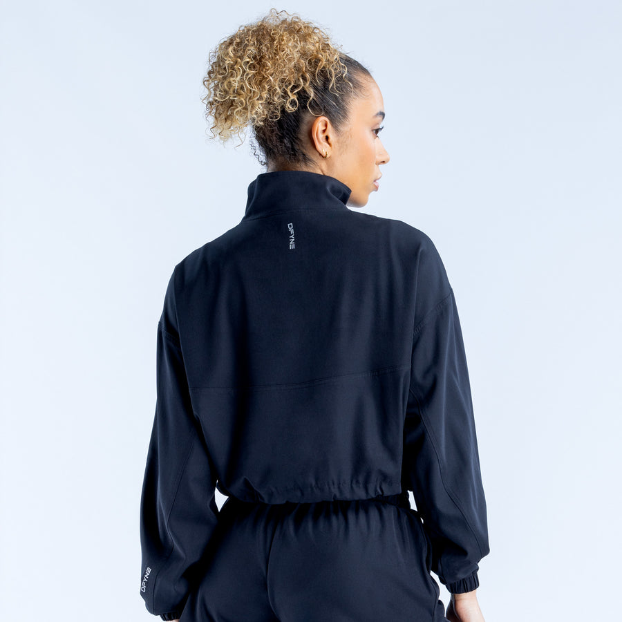 Black cropped zip jacket, back view, high collar, elastic cuffs, cropped waistband