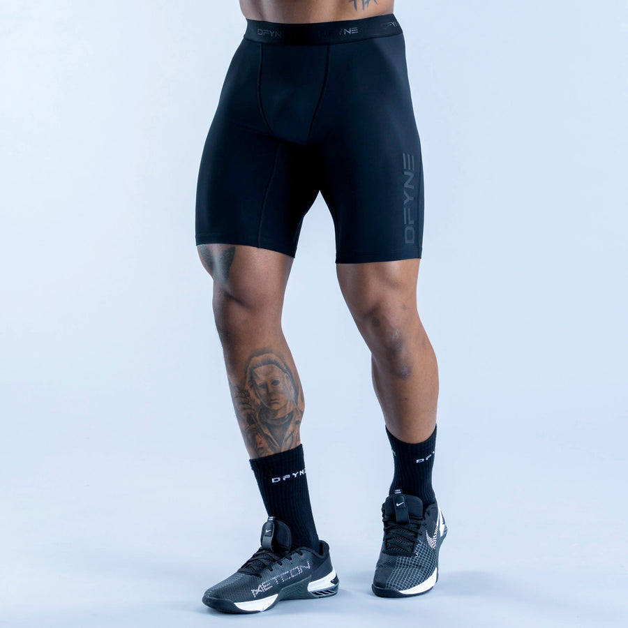 Dark blue compression baselayer shorts, mid-thigh, contoured front, DRYFINE logo