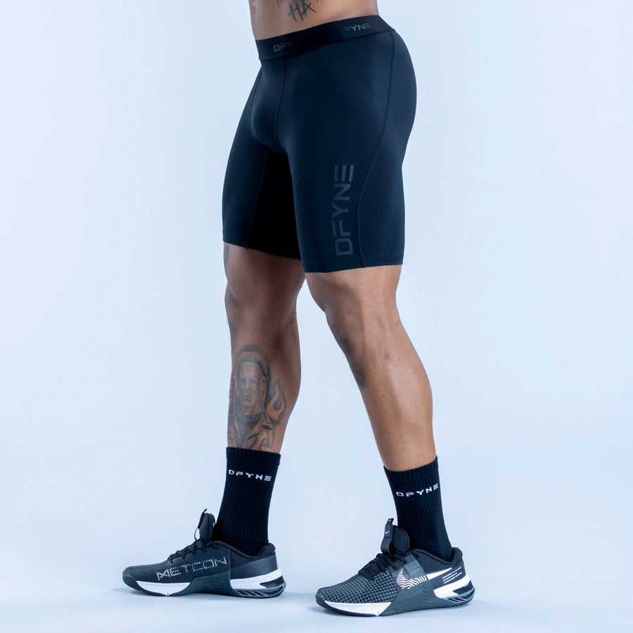 Dark blue compression baselayer shorts, mid-thigh, DRYFINE logo on leg, elastic waist