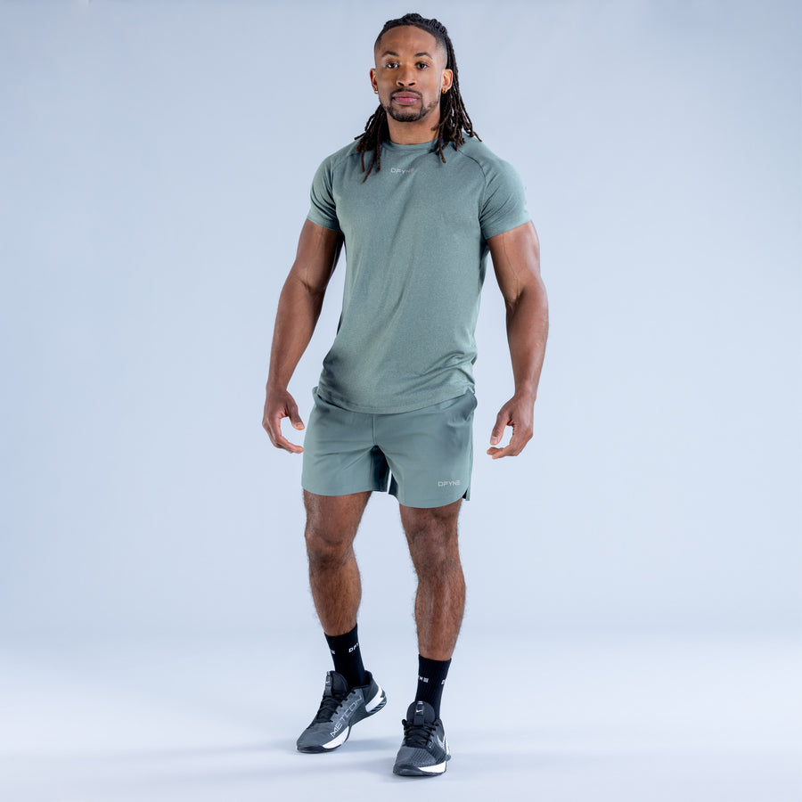 Men's training T-shirt, teal-green crew neck, short sleeves, worn with shorts