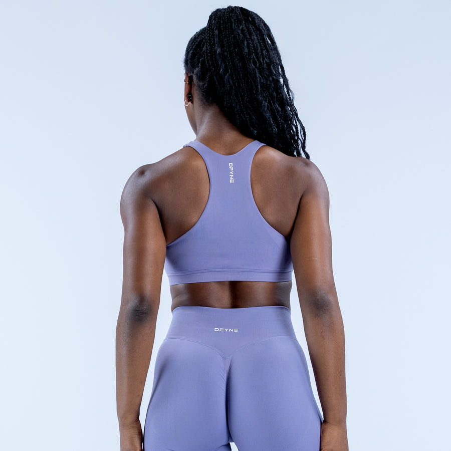 Lavender racerback sports bra, back view with small logo at center neck