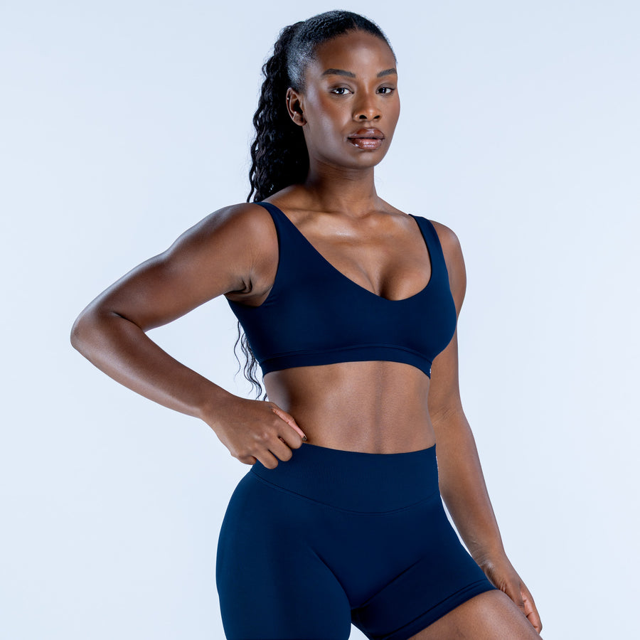 Dark blue scoop-neck sports bra with racerback straps